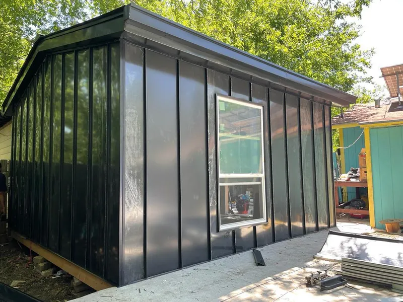 Black standing seam metal wall panels for Metal Roof Installation in Vail