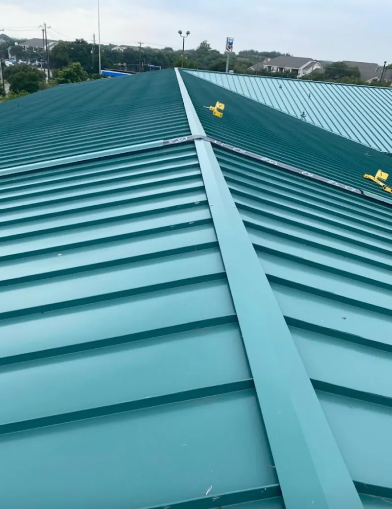 Green commercial metal roof ridge and valley for Metal Roof Repair in Vail