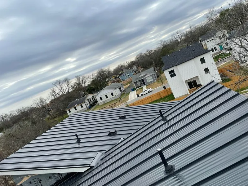 Standing seam metal roof panels with vents for Skylight Repair in Vail